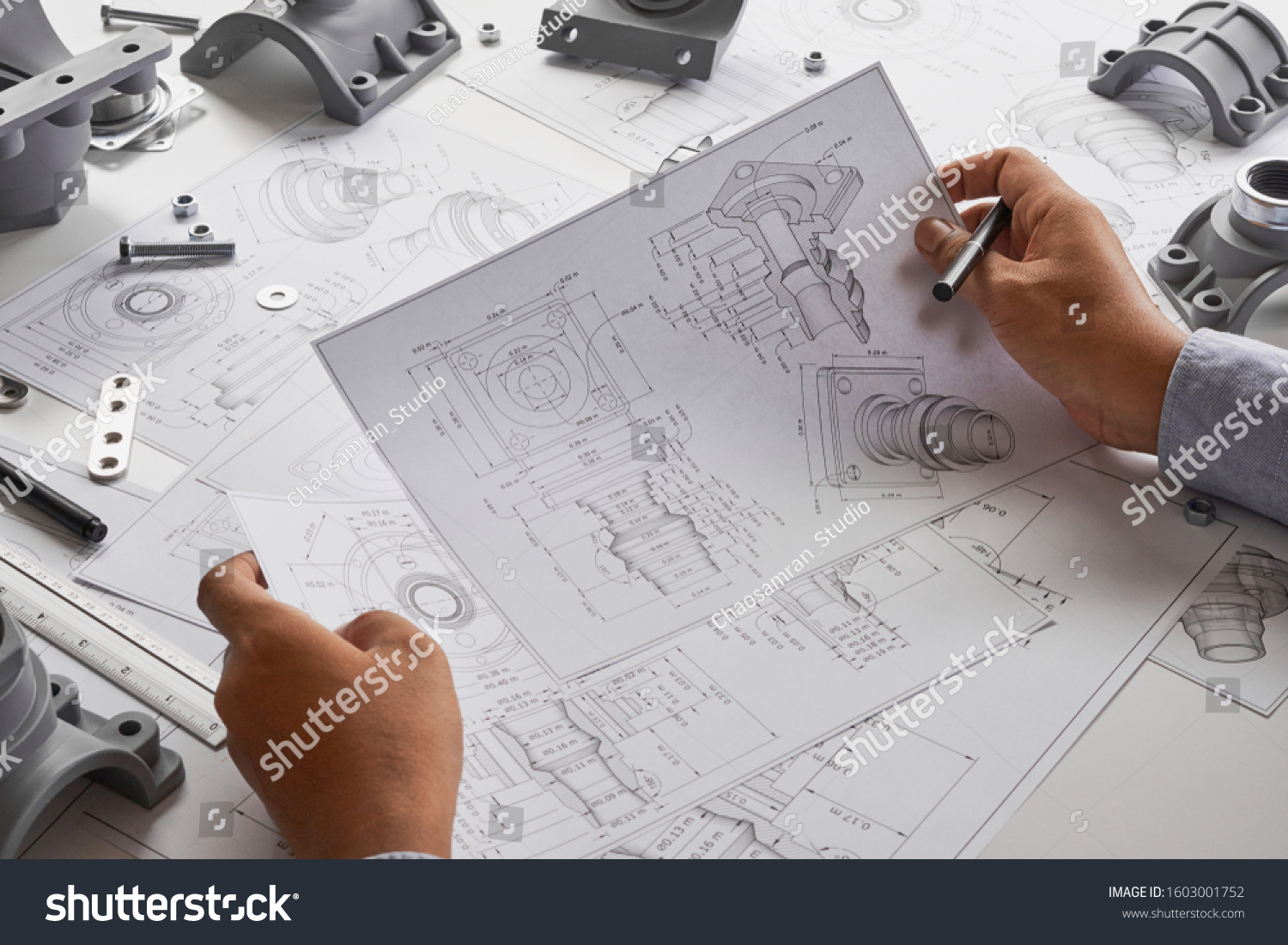 stock-photo-engineer-technician-designing-drawings-mechanical-parts-engineering-engine-manufacturing-factory-1603001752