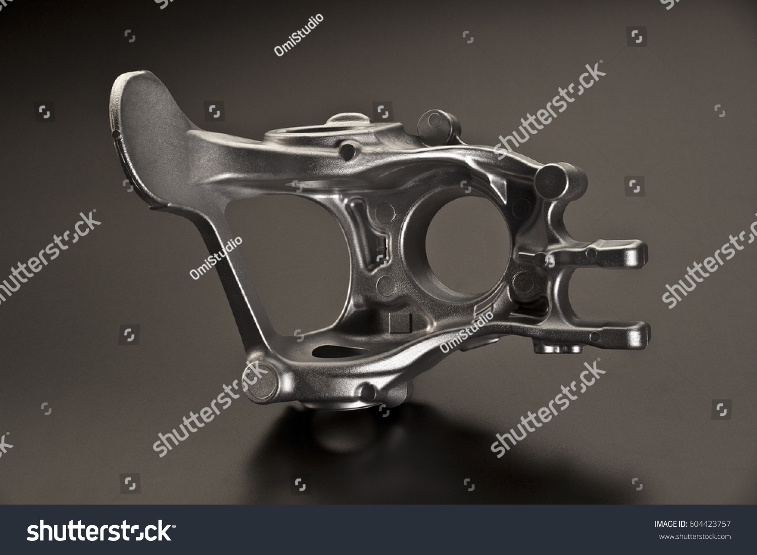 stock-photo-industrial-close-up-of-piece-of-cast-iron-over-dark-background-604423757